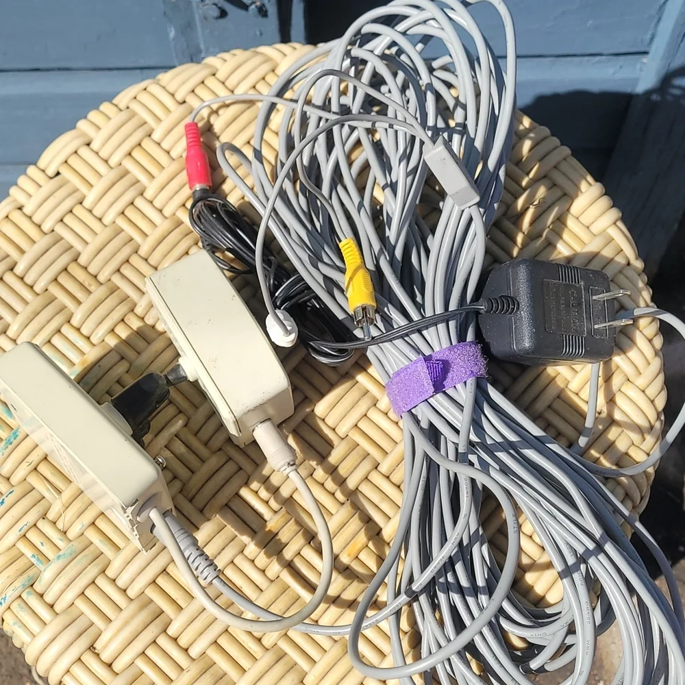 Old radio shack outdoor camera with video and power cord.